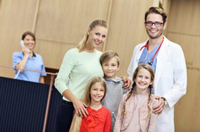 Picture of mother and children together in hospital with doctor