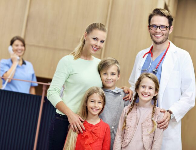 Picture of mother and children together in hospital with doctor